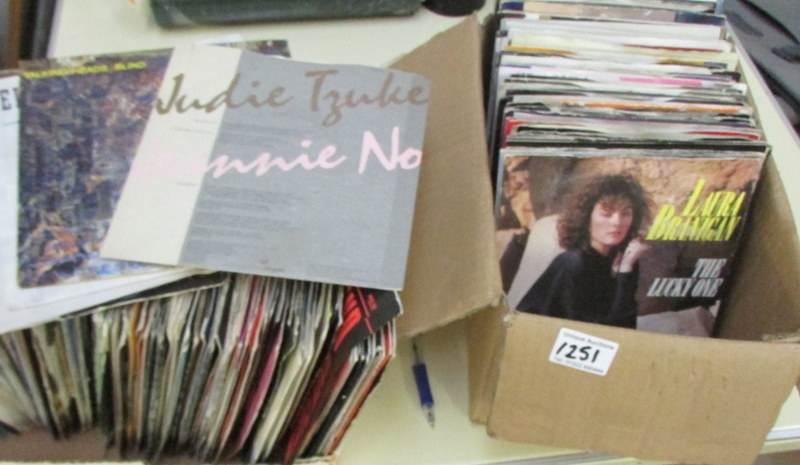 2 boxes of 45 rpm 70's/80's rock and pop records.