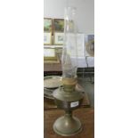 A brass oil lamp with chimney.