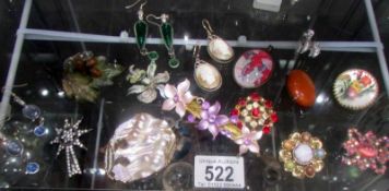 A mixed lot of vintage brooches, earrings etc.