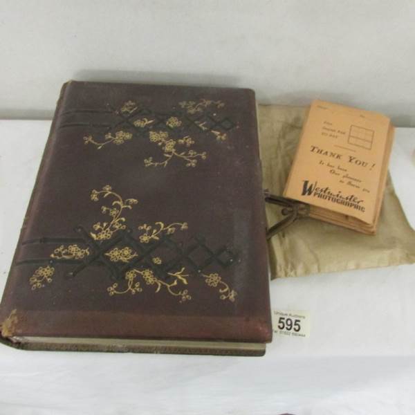A Victorian photograph album with various photographs together with packs of negatives.