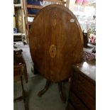 A Victorian mahogany oval inlaid loo table.