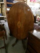 A Victorian mahogany oval inlaid loo table.