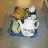 A box of assorted ceramic items including teapot, tankards etc.