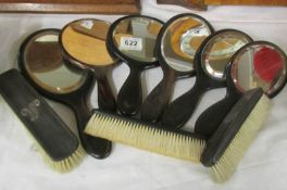 6 hand mirrors and 3 brushes.