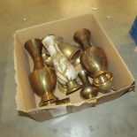 A box of brass vases.