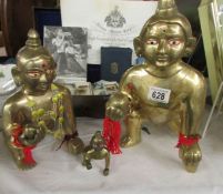 2 large brass Buddha's and a smaller example.