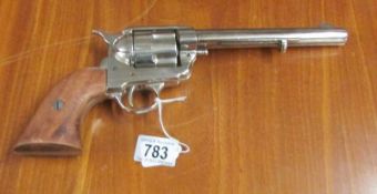 A replica re-enactment revolver.