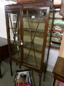 A mahogany astragal glazed cabinet.