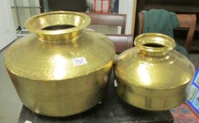 2 large brass pots.