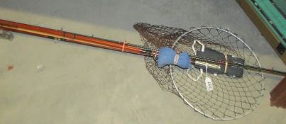 A quantity of fishing rods, keep net etc.