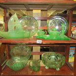 A mixed lot of green glass ware.