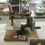 A vintage toy sewing machine.