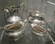 An engraved 4 piece silver plate tea set.