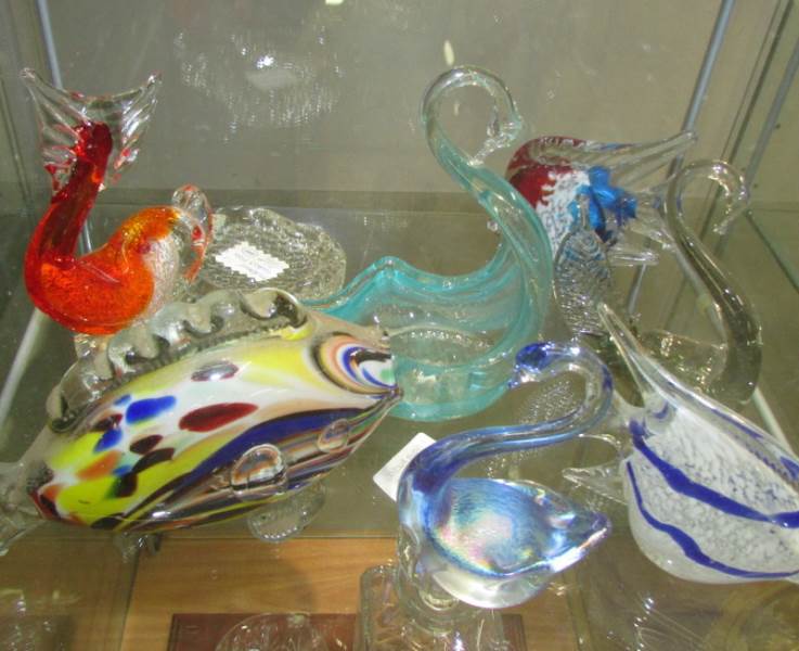 A mixed lot of coloured glass swans, fish etc.