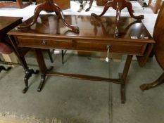 A mahogany sofa table.