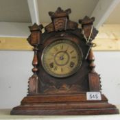 An early 20th century oak cased 8 day mantel clock.