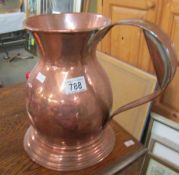 A large copper jug.