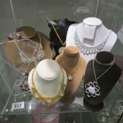 A mixed lot of vintage necklaces, (stands not included).