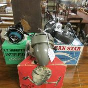 3 boxed fishing reels being an Ocean Star, An Omnia and a K P Morrit's Intrepid.