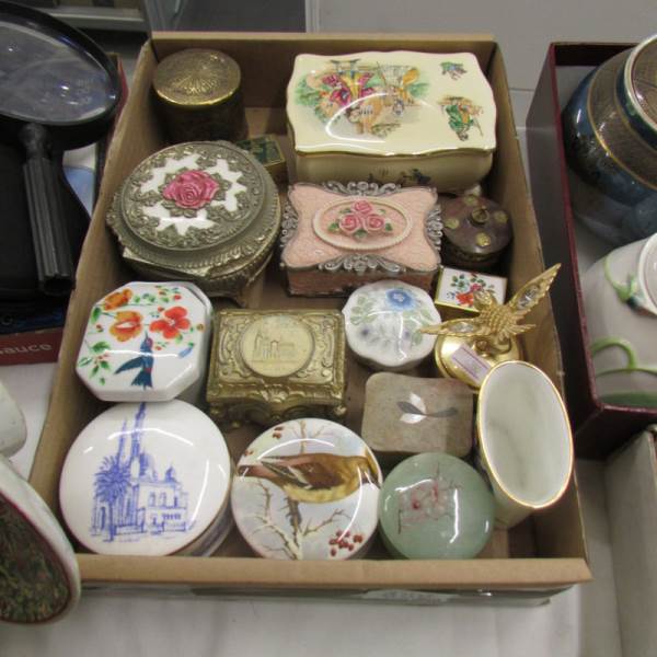 A mixed lot of interesting trinket and pill boxes in metal and china.
