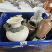 A box of assorted pottery.