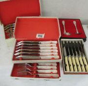 2 boxed sets of fish knives and forks, a boxed set of butter knives and a boxed spoon with pusher.