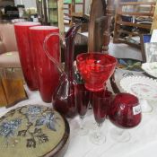 A mixed lot of red glass vases etc.