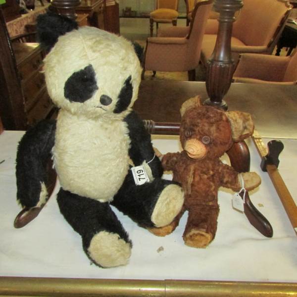 A vintage panda and a vintage teddy bear.