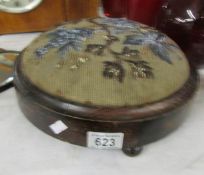 A Victorian foot stool with beaded top.