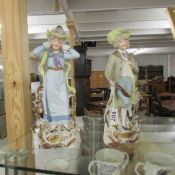 A pair of 19th century continental bisque porcelain figures, in good condition.