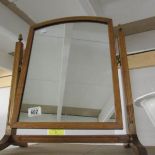 An oak toilet mirror.