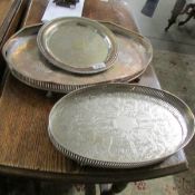 A large silver plate tray and 2 others.