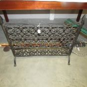 A wrought iron fire screen.