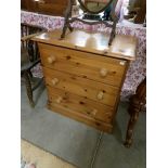 A pine 3 drawer chest.