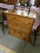 A pine 3 drawer chest.