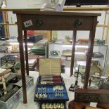 A mahogany side table with imitation drawer to front.