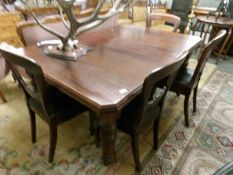 A Victorian mahogany dining table and 4 chairs.