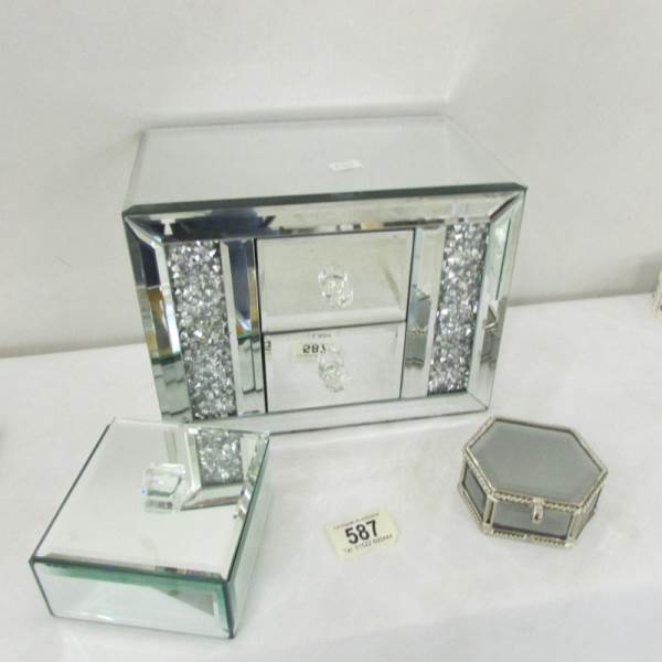 A mirrored jewellery chest and 2 jewellery boxes.