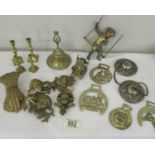 A mixed lot of brass ware including letter clip, horse brasses, miniature candlesticks etc.