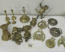 A mixed lot of brass ware including letter clip, horse brasses, miniature candlesticks etc.