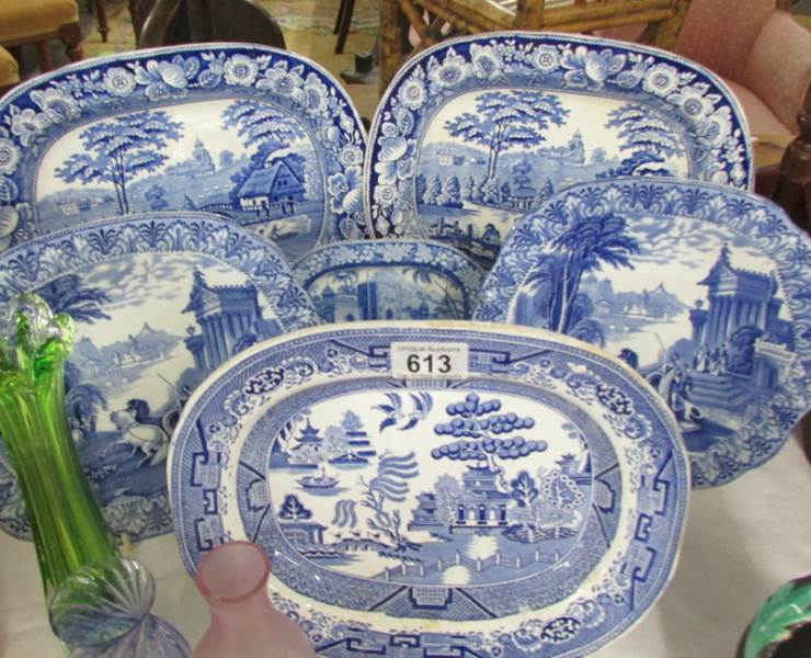 A quantity of blue and white platters and plates.