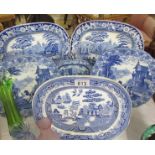 A quantity of blue and white platters and plates.