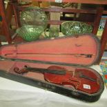 An old violin in wooden case.