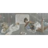 A signed Lladro Collector's society piece, a Lladro cherub and a NAO ballerina.