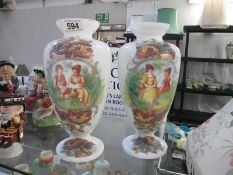 A pair of painted Victorian glass vases