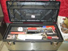 A metal tool box and contents