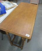 A large light oak gateleg table