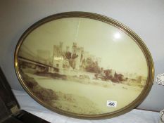 A vintage oval framed and glazed photograph of Conwy Castle