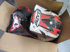 A dirt bike helmet and protective pads