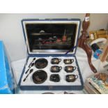 A boxed Chinese laquerware teaset
